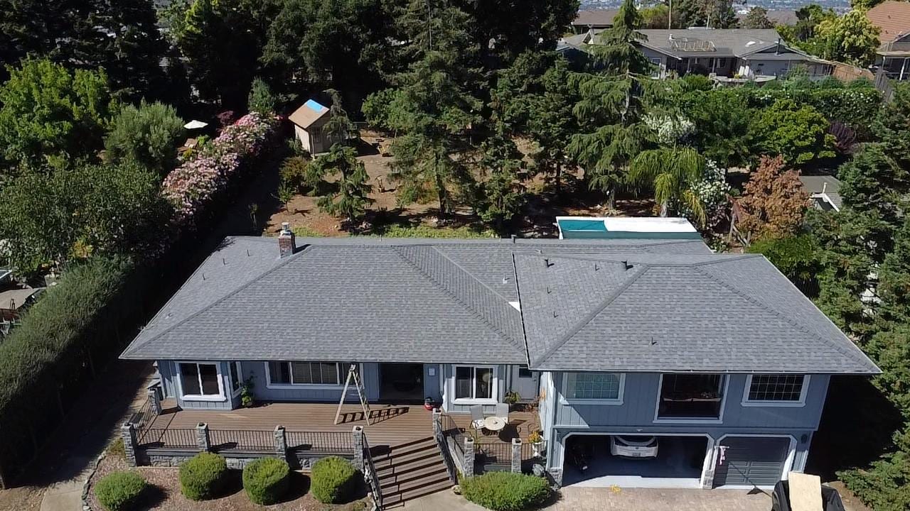 Charcoal Shingle Reroof on a Blue Split-Level Ranch